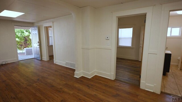 1434 E Evans Ave, Pueblo, CO 81004 - spare room with baseboards, visible vents, and wood finished floors