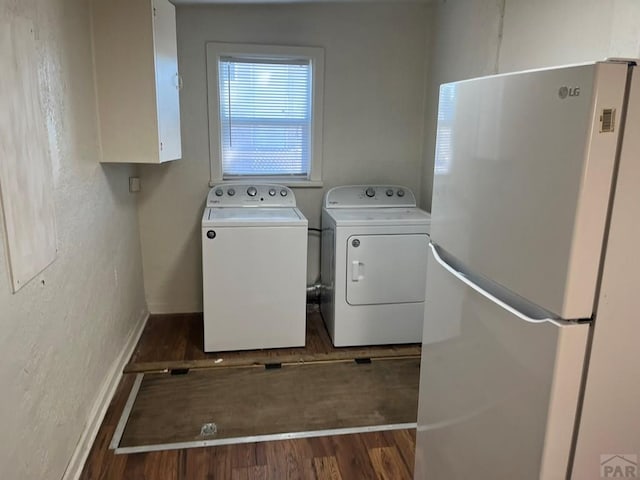 1434 E Evans Ave, Pueblo, CO 81004 - washroom featuring separate washer and dryer, laundry area, a textured wall, baseboards, and wood finished floors