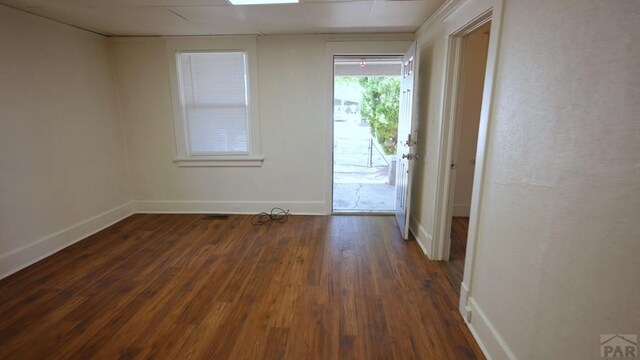 1434 E Evans Ave, Pueblo, CO 81004 - unfurnished room featuring dark wood-style floors and baseboards