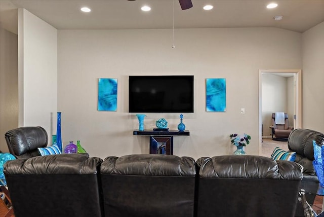 living area featuring vaulted ceiling, a ceiling fan, and recessed lighting