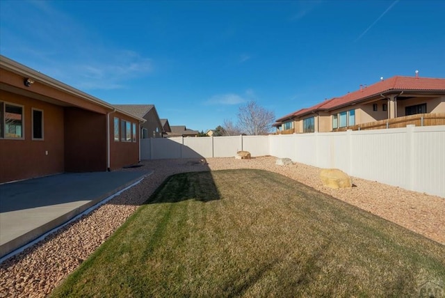 view of yard featuring a fenced backyard