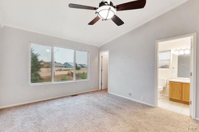 8718 Silver Glen Dr, Fountain, CO 80817 - unfurnished bedroom with lofted ceiling, light carpet, ornamental molding, ensuite bathroom, and a ceiling fan