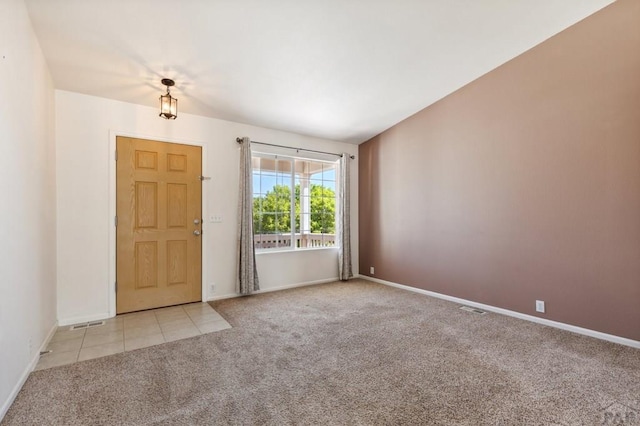 8718 Silver Glen Dr, Fountain, CO 80817 - carpeted foyer featuring baseboards and tile patterned floors
