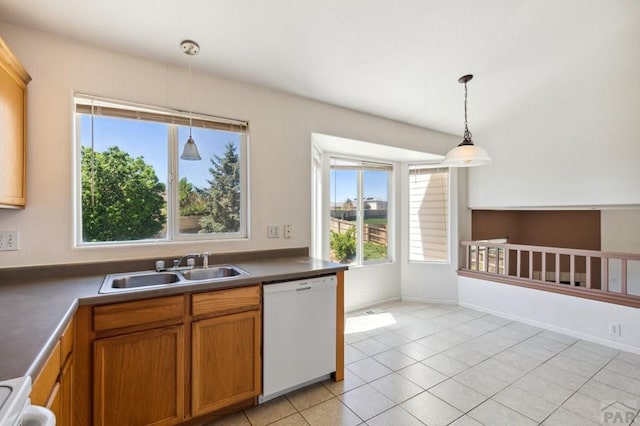 8718 Silver Glen Dr, Fountain, CO 80817 - kitchen with white dishwasher, pendant lighting, brown cabinetry, stove, and light tile patterned floors