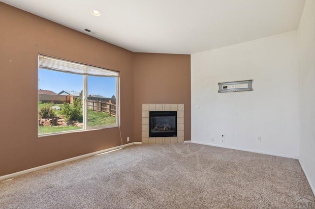 8718 Silver Glen Dr, Fountain, CO 80817 - unfurnished living room featuring carpet floors, a tile fireplace, and recessed lighting