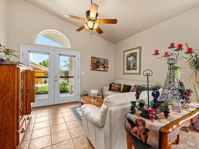 living area featuring light tile patterned floors, ceiling fan, vaulted ceiling, and french doors