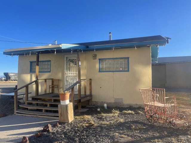 106 E 4th St, Antonito, CO 81120 - back of house featuring stucco siding