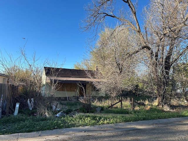 view of home's exterior featuring fence