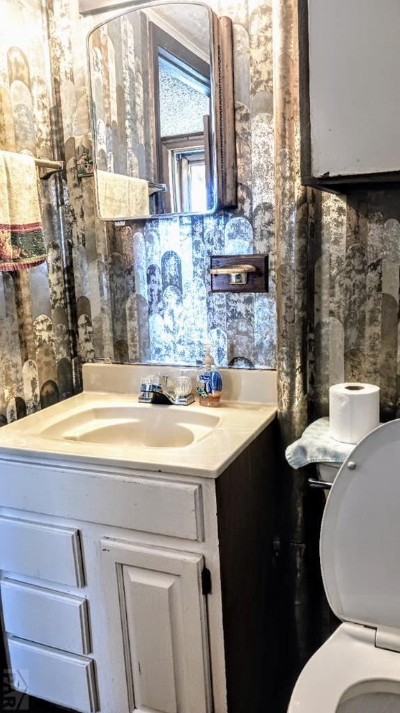 2318 W 17th St, Pueblo, CO 81003 - half bath with vanity and toilet