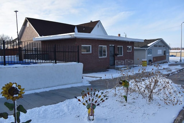 ranch-style home with fence