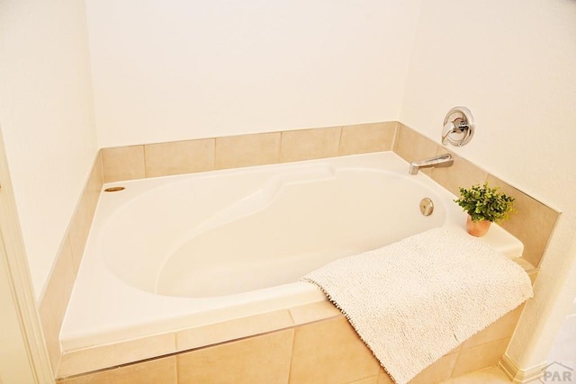 full bath featuring a tub to relax in