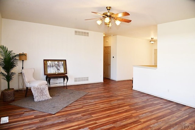 unfurnished room featuring visible vents, ceiling fan, and wood finished floors