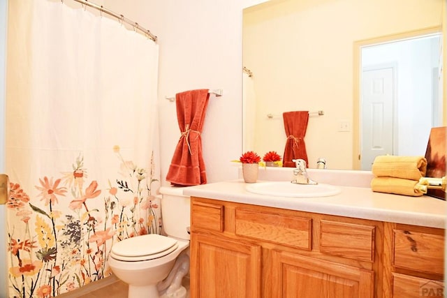 full bathroom with vanity and toilet