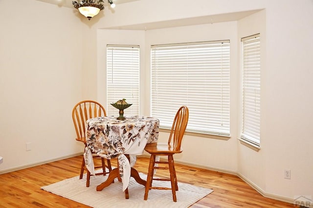 dining room featuring light wood-style floors and baseboards