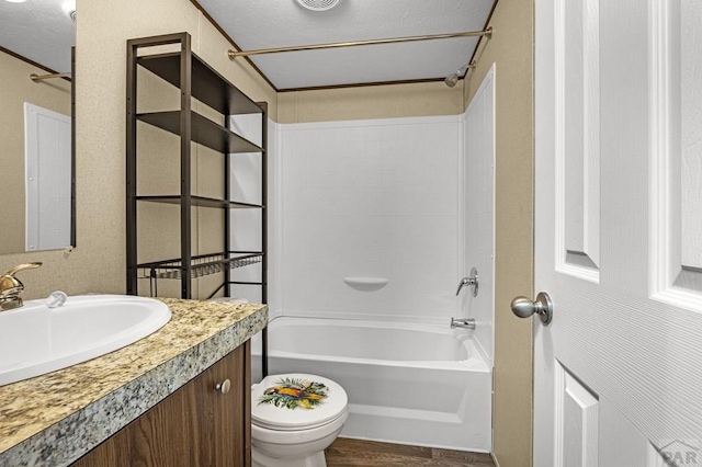 510 N 19th St Unit 13B, Canon City, CO 81212 - bathroom with toilet, vanity, bathing tub / shower combination, and wood finished floors