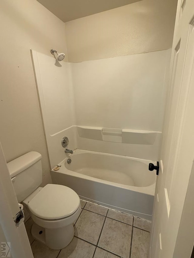 bathroom featuring shower / bath combination, toilet, and tile patterned floors