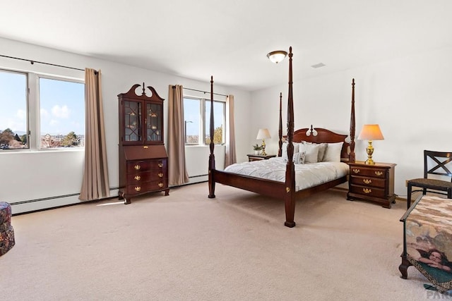 bedroom featuring light colored carpet and a baseboard radiator