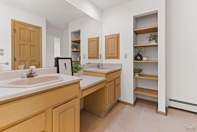 bathroom featuring a sink, a baseboard radiator, built in shelves, and two vanities