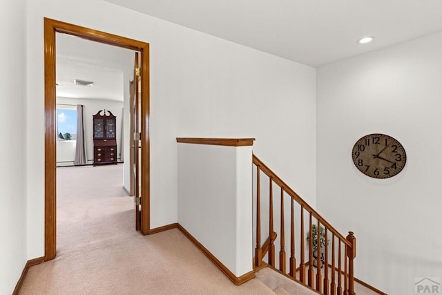 corridor with recessed lighting, carpet flooring, an upstairs landing, and baseboards