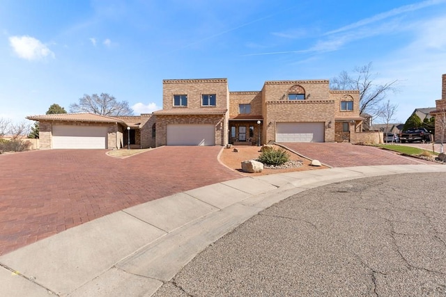 view of front of property featuring a garage and driveway