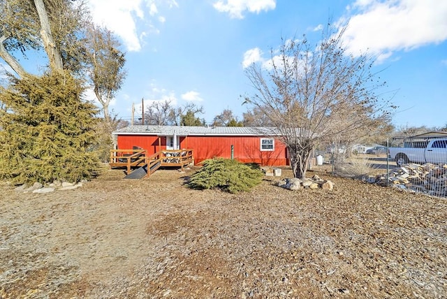 view of front of house featuring fence