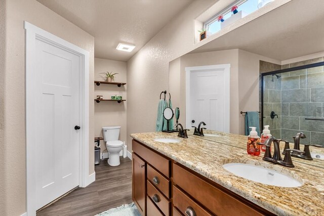 kitchen with visible vents, stainless steel appliances, a sink, and a center island with sink