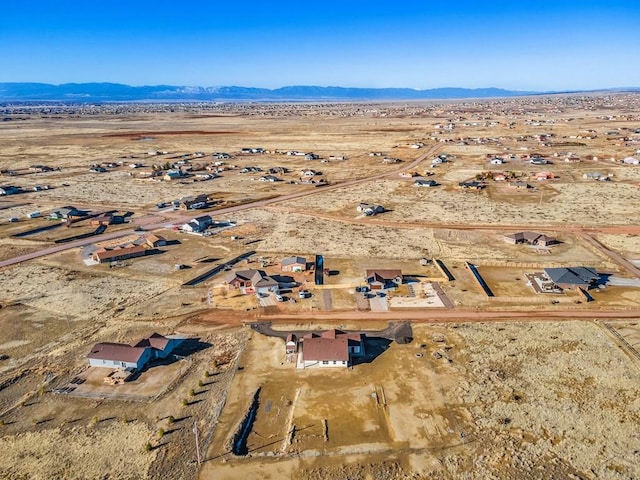 aerial view with a mountain view and a desert view