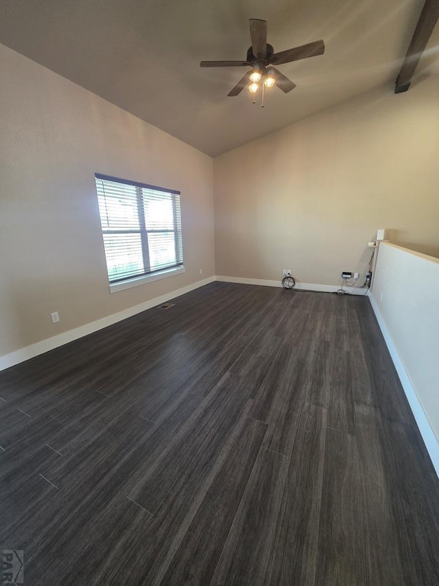 1216 N Whitetail Pl, Pueblo, CO 81007 - unfurnished room featuring dark wood-style flooring, lofted ceiling, a ceiling fan, and baseboards