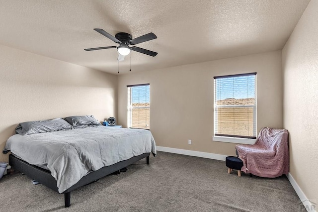 1216 N Whitetail Pl, Pueblo, CO 81007 - bedroom featuring carpet flooring, a textured ceiling, a ceiling fan, and baseboards