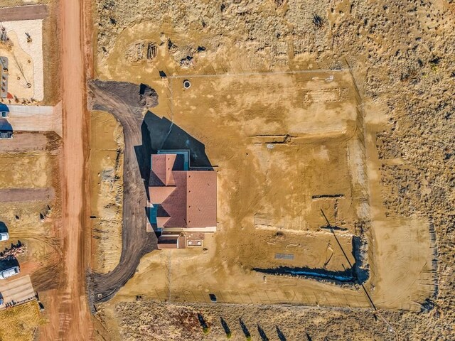 bird's eye view featuring a mountain view and view of desert