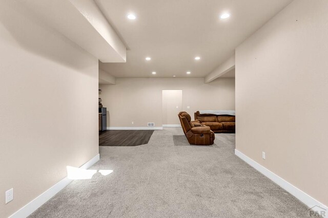 bedroom with carpet, a textured ceiling, and baseboards