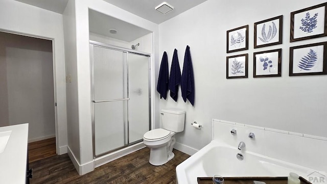 316 N Hooper Ave, Walsenburg, CO 81089 - bathroom featuring a bath, wood finished floors, and a shower stall