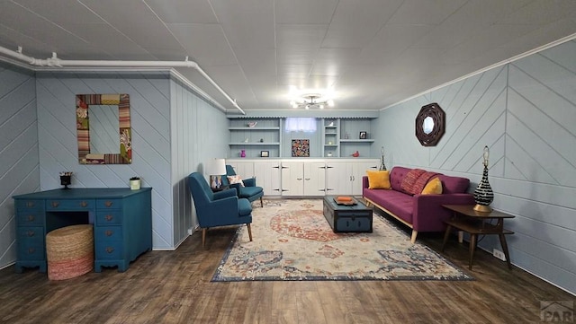 316 N Hooper Ave, Walsenburg, CO 81089 - living area with dark wood-type flooring, built in features, and ornamental molding