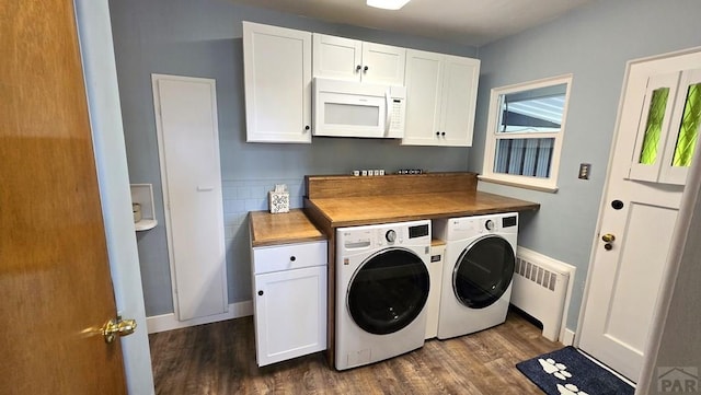 316 N Hooper Ave, Walsenburg, CO 81089 - washroom with washer and clothes dryer, radiator, dark wood-type flooring, and cabinet space
