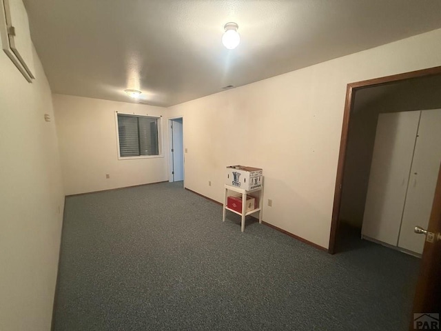 304 S Mullen, Lamar, CO 81052 - spare room featuring carpet flooring
