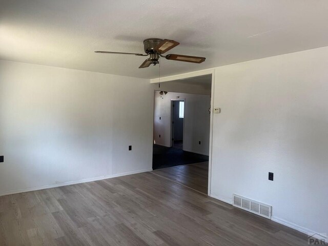 304 S Mullen, Lamar, CO 81052 - spare room featuring ceiling fan and wood finished floors