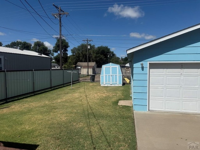 304 S Mullen, Lamar, CO 81052 - view of yard featuring a garage and a storage shed
