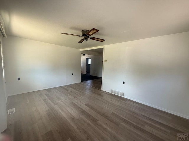304 S Mullen, Lamar, CO 81052 - spare room featuring a ceiling fan and wood finished floors