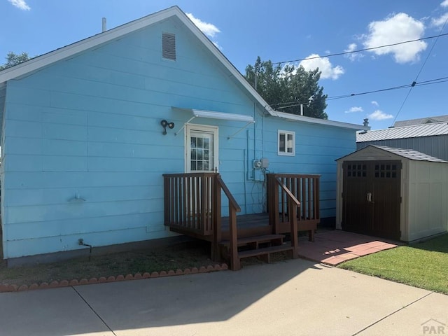 304 S Mullen, Lamar, CO 81052 - back of property featuring a storage unit and a patio area