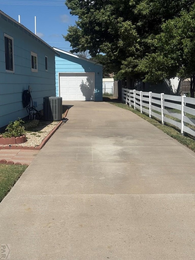 304 S Mullen, Lamar, CO 81052 - view of side of property featuring concrete driveway and a garage