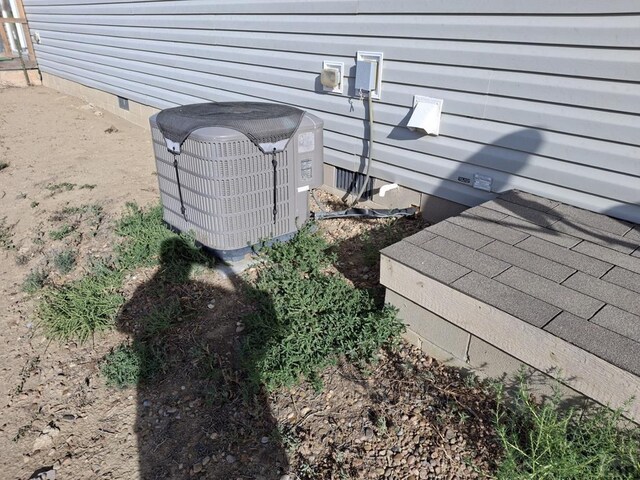 exterior details with crawl space and central air condition unit