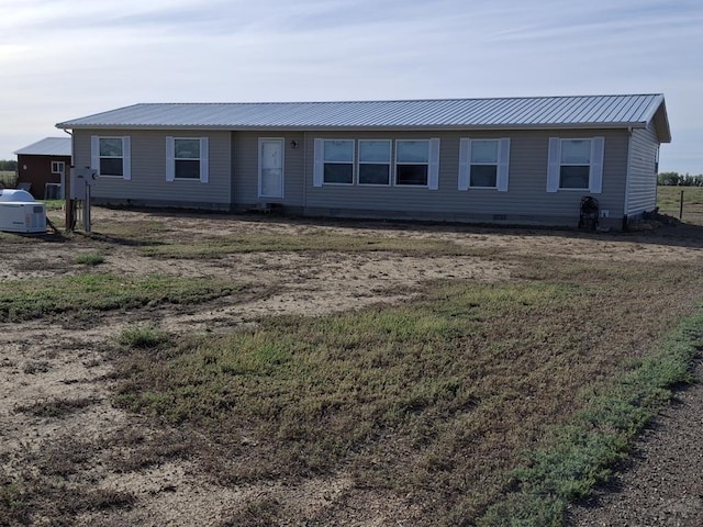 single story home with metal roof, crawl space, and central air condition unit