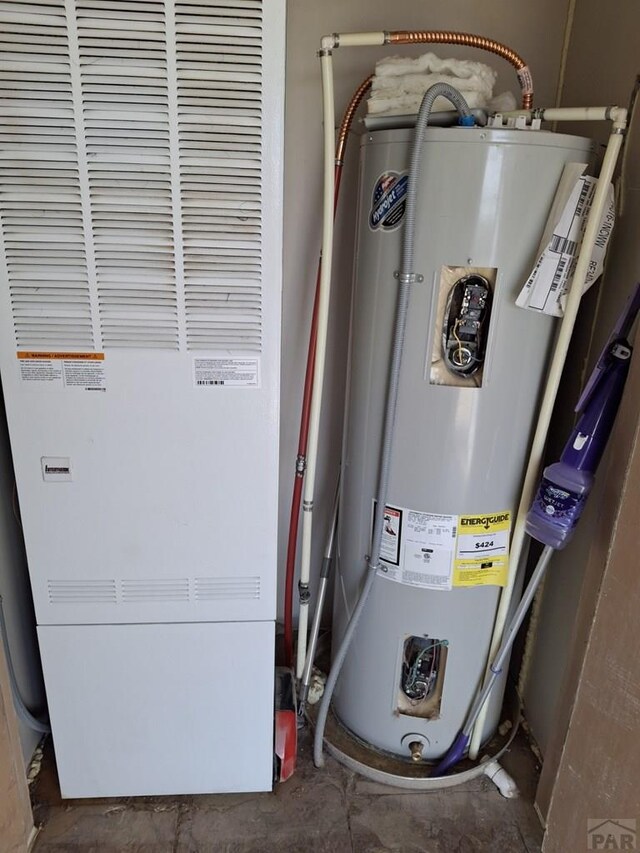 utilities featuring water heater and a heating unit