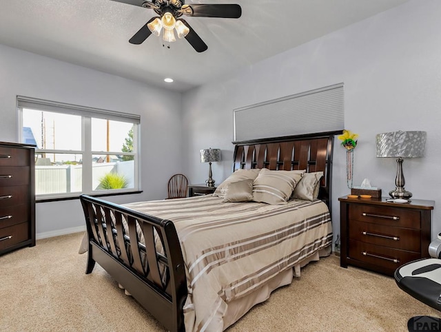 bedroom with baseboards, recessed lighting, a ceiling fan, and light colored carpet