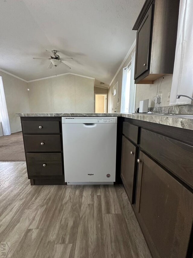 kitchen with ornamental molding, dishwasher, dark brown cabinetry, and wood finished floors