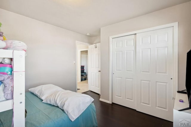 5073 Buchanan Dr, Pueblo, CO 81008 - bedroom featuring dark wood finished floors and a closet