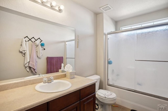 5073 Buchanan Dr, Pueblo, CO 81008 - full bathroom with vanity, shower / bath combination with glass door, and tile patterned flooring