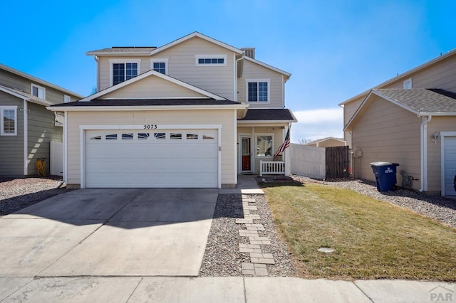 5073 Buchanan Dr, Pueblo, CO 81008 - traditional-style home with concrete driveway and an attached garage