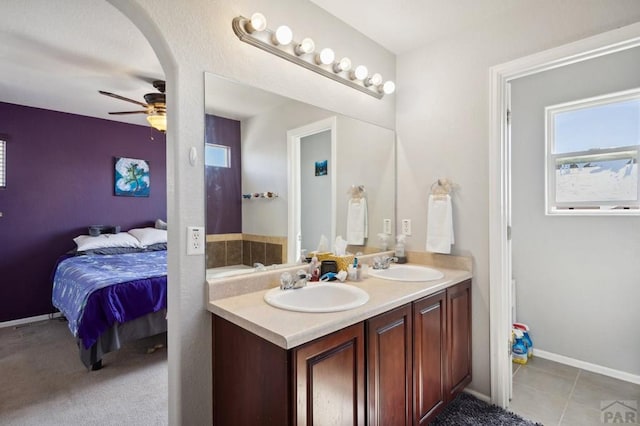 5073 Buchanan Dr, Pueblo, CO 81008 - ensuite bathroom with double vanity and ceiling fan