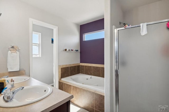 5073 Buchanan Dr, Pueblo, CO 81008 - full bath with a shower stall, a tub with jets, and double vanity
